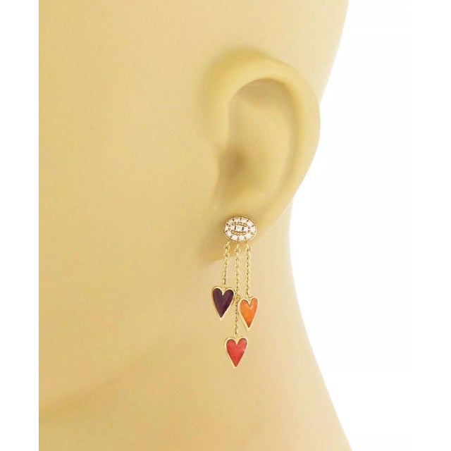 This lovely pair of authentic earrings are by Kabana, crafted from 14k yellow gold featuring triple strand chain with an...