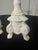 A matching pair of vintage ceramic taper candlesticks produced by Napco (Napcoware) during the mid-20th century. Molded in...