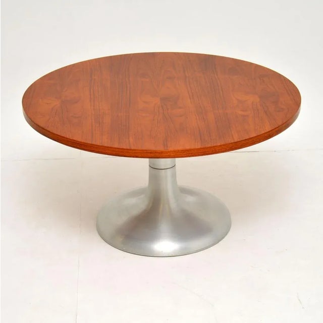 A stylish and very well made vintage coffee table, this dates from the 1960-70’s. It has a beautiful circular teak top,...
