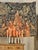 A large French tapestry by Tapisseries du Lion, depicting an elaborate medieval courtly garden scene filled with richly...