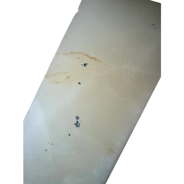 This sculpture is heavy and gorgeous. The brown veining is unique and natural. It was sold as a pair, I think, suggesting...