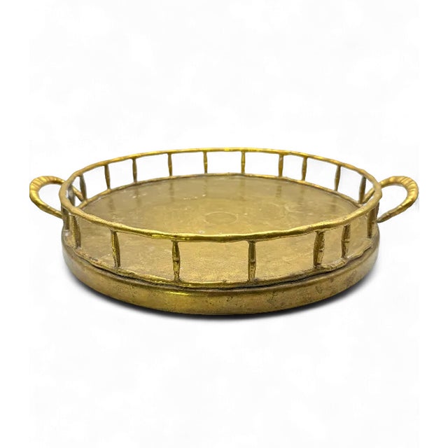 This striking vintage serving tray captures the timeless glamour of the Hollywood Regency era. Crafted from solid brass,...