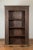 An Indian Gujarat wooden bookcase from the 19th century, with carved rosette and foliage. Created on the Western coast of...