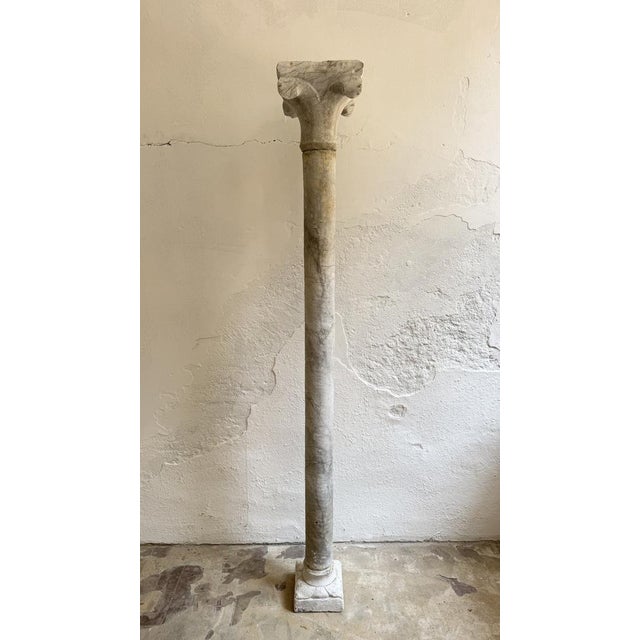 15th-century marble column. Italy. This Renaissance architectural element consists of a slender, smooth shaft with visible...