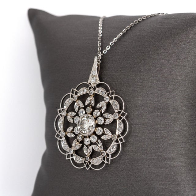 Crafted in genuine platinum, this radiant flower pendant showcases brilliant earth-mined diamonds for a classic yet...