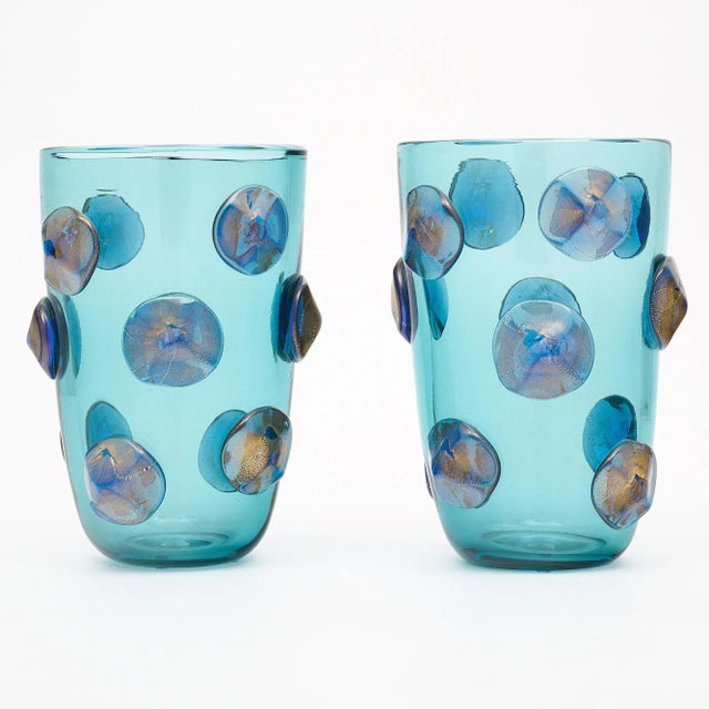 Murano glass medallion vases made of blue glass with 23 carat gold leaf flecks in the cobalt blue glass that makes up the...