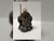 This Italian Baroque style shepherd figurine represents a seated pastoral figure in a moment of quiet rest, holding a...