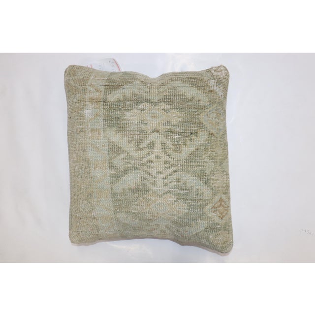 Pillow made from an antique Persian Malayer rug in pale green Measures: 18'' x 19''.