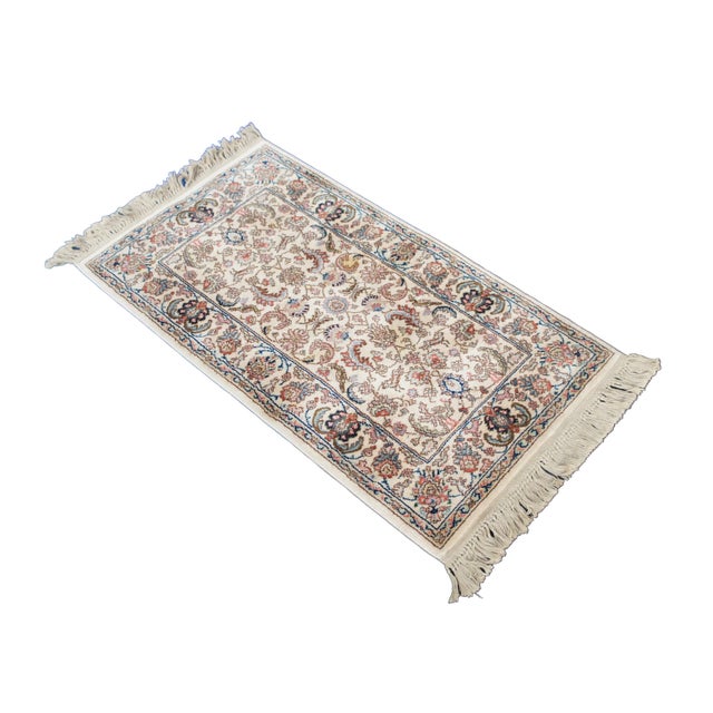 Vintage Karastan 100% wool area rug / mat / carpet featuring a floral motif inspired by palmettes and scrolled vines with...
