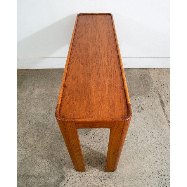 American designed solid oak and oak veneer console table. The Sculptural design and the extremely high quality...