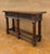 This elegant Spanish console table, dating from around 1890, is crafted in solid walnut and richly decorated with hand-...