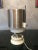 This stockroom found table lamp is made from opaline glass, aluminum, wood, and galvanized metal. European Plug (up to...
