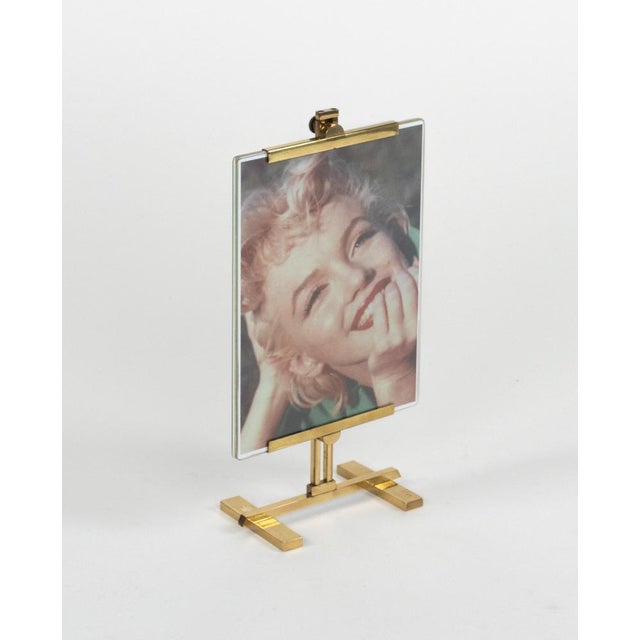 Midcentury amazing large rectangular picture frame in brass and glass in the style of Paul Lobel. Made in Italy in the 1950s.