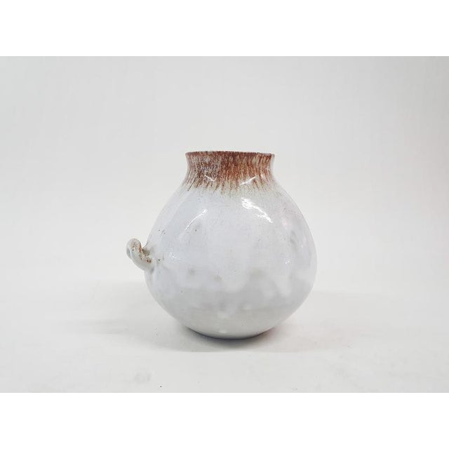 About this item White ceramic vase by Mobach Keramiek with two ears. Marked at the bottom This piece is attributed to the...