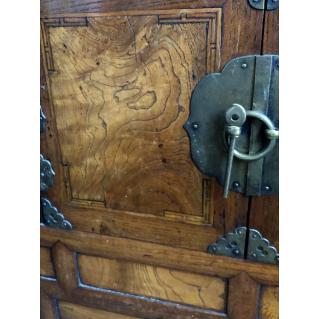 This antique Korean scholars chest is made from a Zelkova that has so many impressive grain patterns resembling coiled...