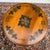 A vintage Ethan Allen Rustic Farmhouse solid maple accent table having a round stenciled top with flower motifs over a...