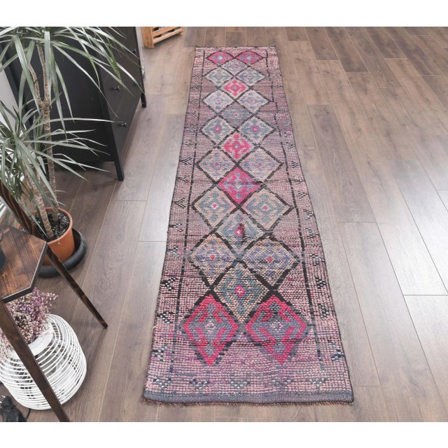 Vintage Turkish Hand-Knotted Hallway Runner Rug is a semi-Vintage rug. '80s Eastern region of Turkey's unique rug is...