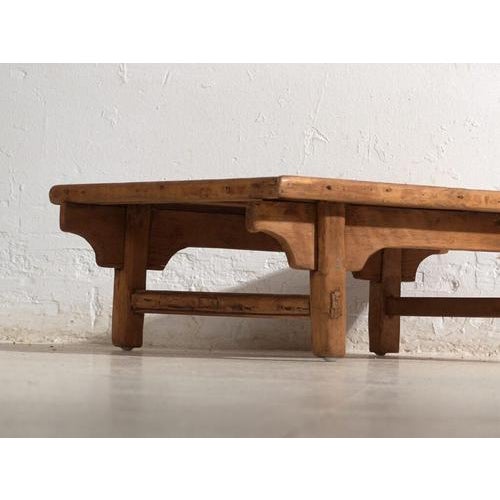 Antique low table in pine wood, traditional Chinese furniture originating from northern China and dated circa 1930....