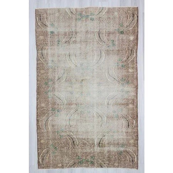 Hand knotted distressed Turkish art deco rug from Isparta region of Turkey. In good condition. Approximately 60 years old.