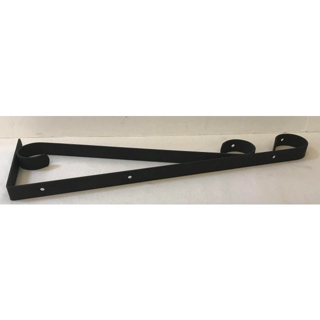 Nice black wrought iron double hook plant hanger. Great for hanging baskets!