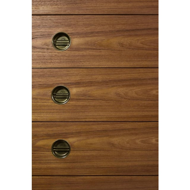 This high chest of drawers was made in Denmark during the 1960s. This type of chest of drawers is often referred to as...