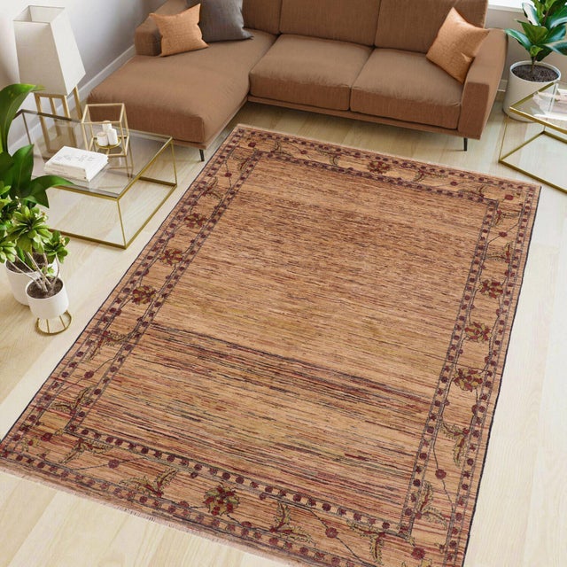 Transform your home's interior with a stunning hand-knotted Gabbeh rug. These rugs are meticulously crafted with bold...