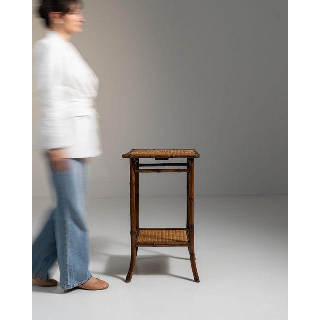 Caned oak side table in Weathered Honey Oak. The weathered honey oak surface highlights woven cane lower shelf, turned...