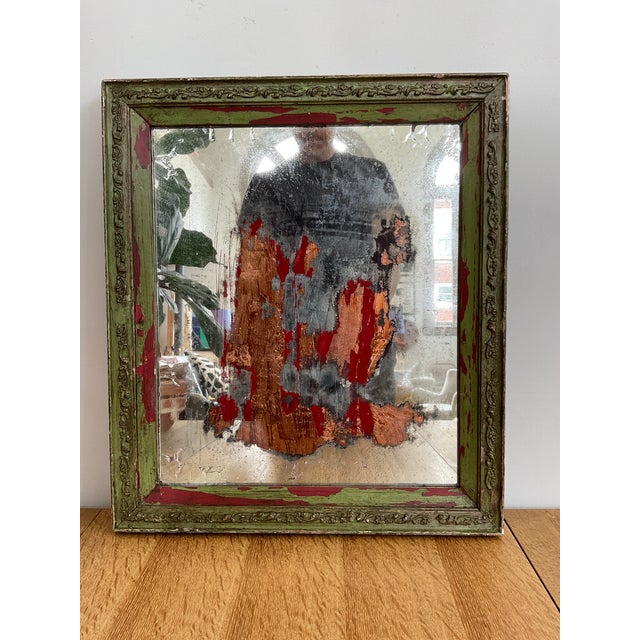 Unique rectangular wall mirror featuring distinctive copper accents and a beautifully aged finish. Adds warmth, depth, and...