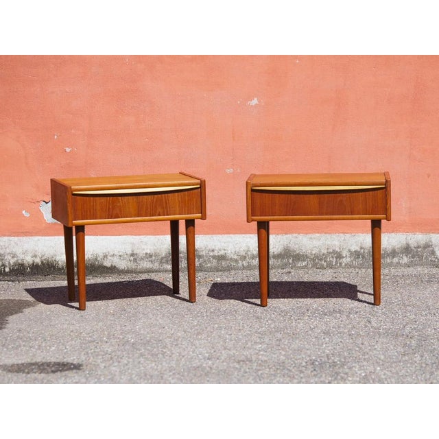 Original teak nightstands in the Mid-Century Modern (MCM) style. Featuring two spacious drawers with milled handles and...