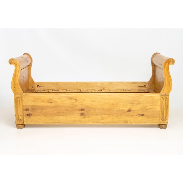 English Pine Sleigh Bed Frame, with carved accents above bun feet. 40" H x 90.5" W x 42.25" D. Provenance: From an Upper...
