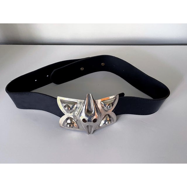 A wide leather belt with large sterling silver buckle crafted by Graziella Laffi (1923-2009), Lima, Peru, circa 1960-70s....