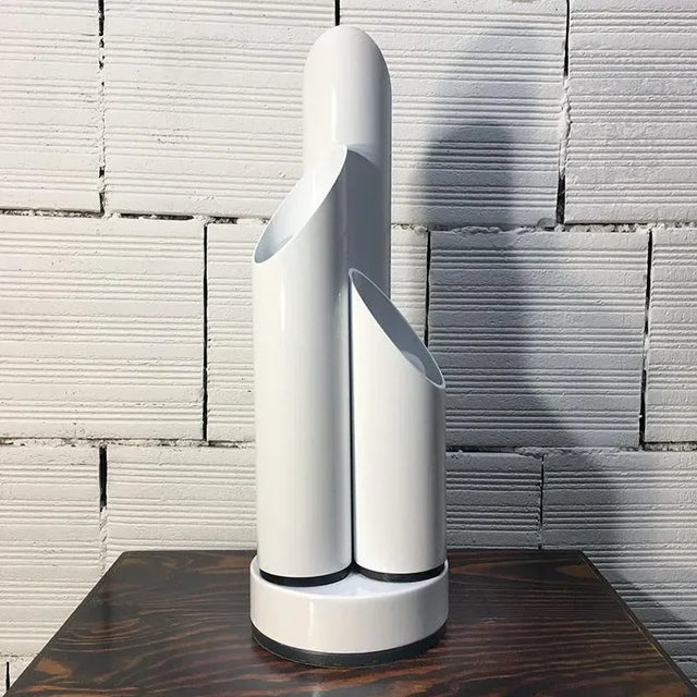 Space Age lamp in white metal formed by 3 cylinders with different heights. The cylinders have the black metal base and...