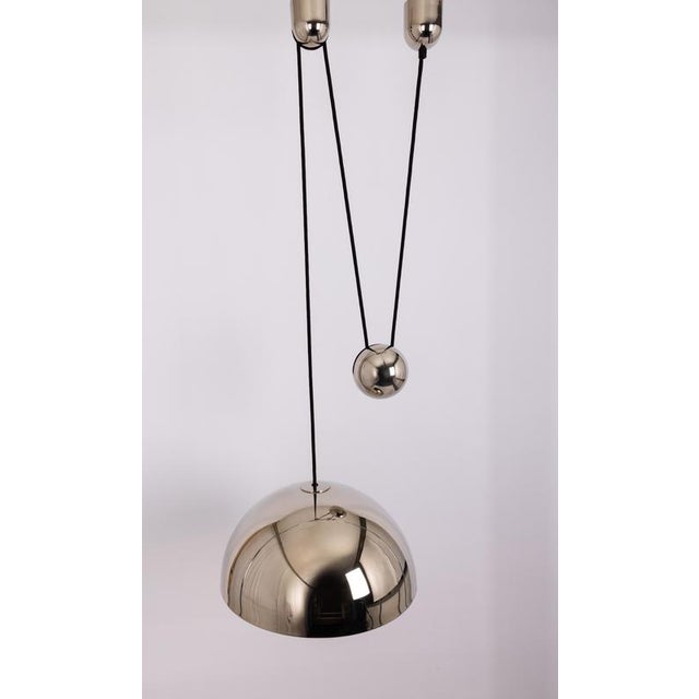 Stunning posa chrome pendant with adjustable counterweight designed by florian schulz, germany, 1980s it is a masterpiece...