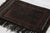 Hand-knotted in wool, this 2x4 vintage Pakistani rug from circa 1950- 1960 reflects a rich tribal heritage through its...
