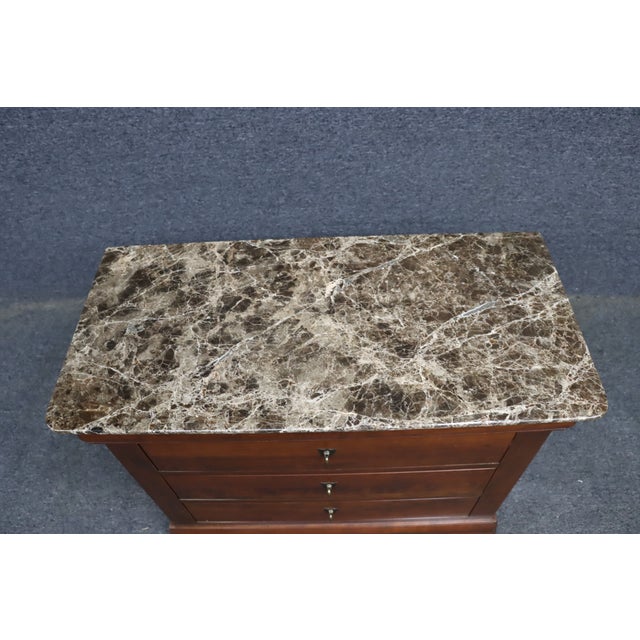 Canadian-made solid cherry Louis Philippe style nightstand by Durham Furniture, featuring a richly finished cherry case...