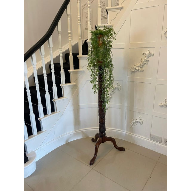 Antique carved mahogany torchere/plant stand having a mahogany dish top supported by a fabulous carved shaped turned...