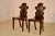 Pair of 19th century mahogany hall chairs from England. The backs are in the shape of shields, which are pierced and have...