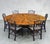 An exceptional English Regency-inspired dining table by Maitland-Smith, crafted with a richly figured flame mahogany...