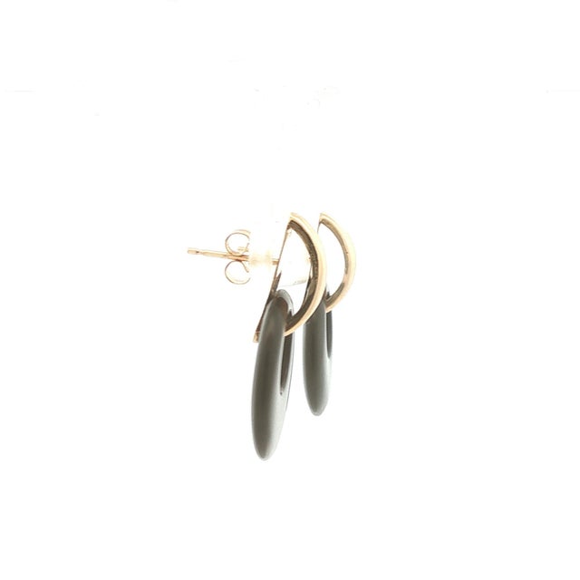 A sleek pair of doorknocker earrings with onyx and 14k gold. They measuring 1.1 inches in height. In great condition.
