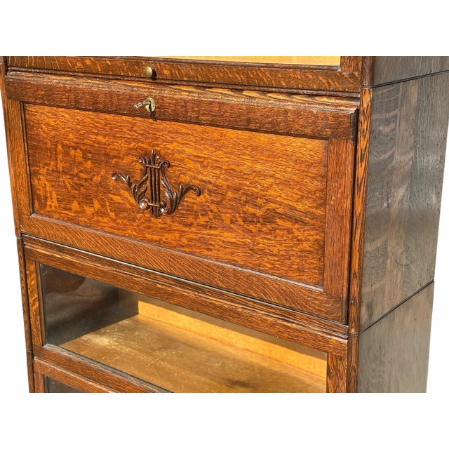 With our highest compliments Bay Colony Antiques takes the utmost pleasure in offering this remarkable antique bookcase....