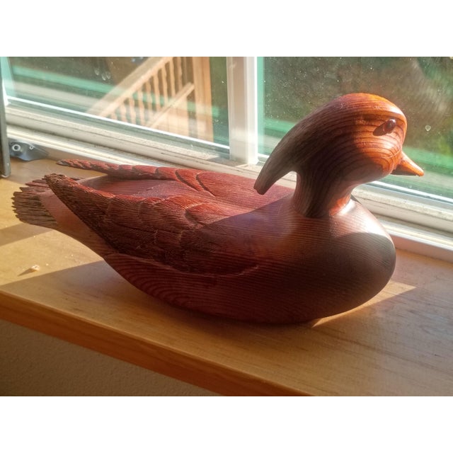 An exceptional example of contemporary American folk art, this hand-carved Wood Duck Drake decoy is a masterclass in...