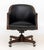 Modern Black Leather Upholstered Mahogany Swivel Office Chair, brass nail head trim, wood legs on casters. 33" H x 24.75"...