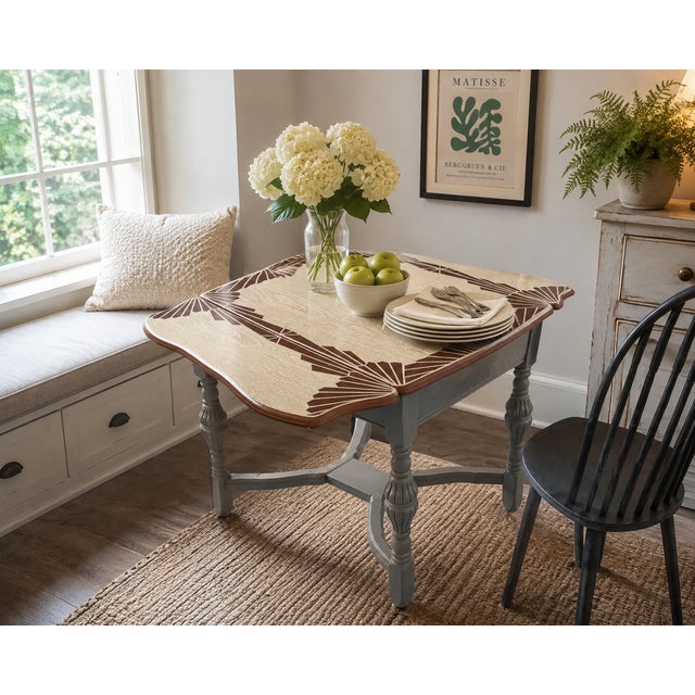 This beautifully restored vintage Art Deco drop-leaf table combines timeless design with exceptional versatility. The...