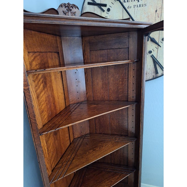 Beautiful early 20th-century American Victorian / Edwardian-style corner curio display cabinet, expertly crafted from...