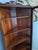 Beautiful early 20th-century American Victorian / Edwardian-style corner curio display cabinet, expertly crafted from...