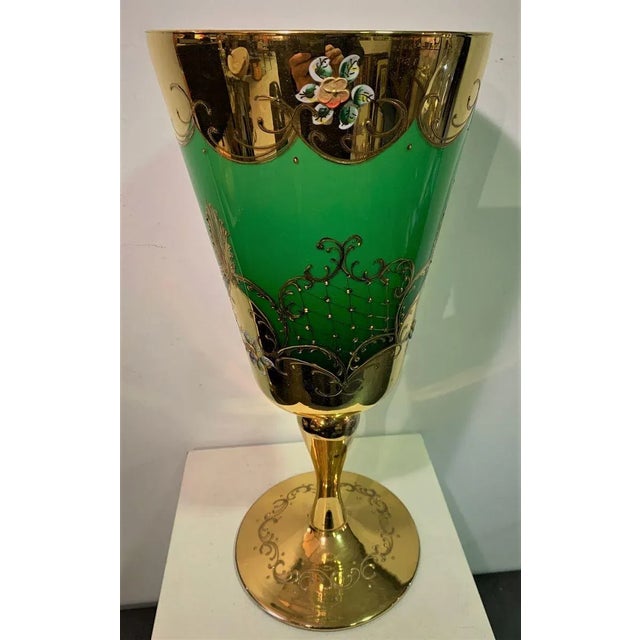 Murano Glass, green glass with gold ornaments and 24 kt enameled floral ornaments. This piece has an attribution mark, I...