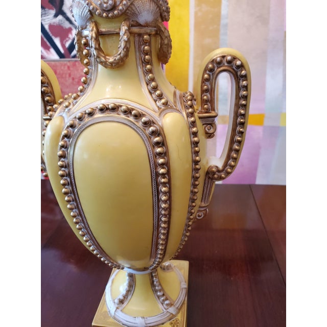 A very rare antique yellow porcelain urn attributed to French sevres. Having exquisite sea shell and beaded porcelain...
