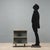 1960s metal cabinet characterized by an essential and functional design. The cabinet features an open compartment divided...
