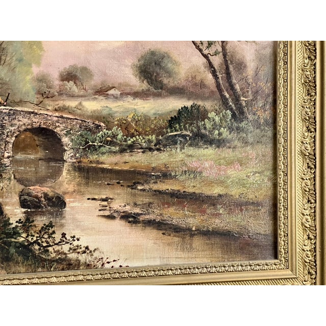 This charming early 20th century oil on canvas landscape titled “Spectacle Bridge” captures a peaceful pastoral scene...