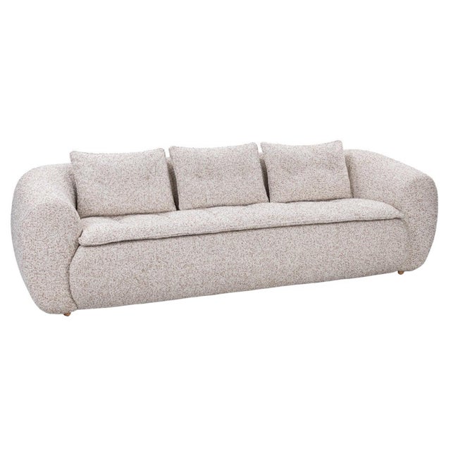 Relaxed modern style sofa with soft upholstery in a subtle mixture of white and beige/tan. Tufted seating and back...